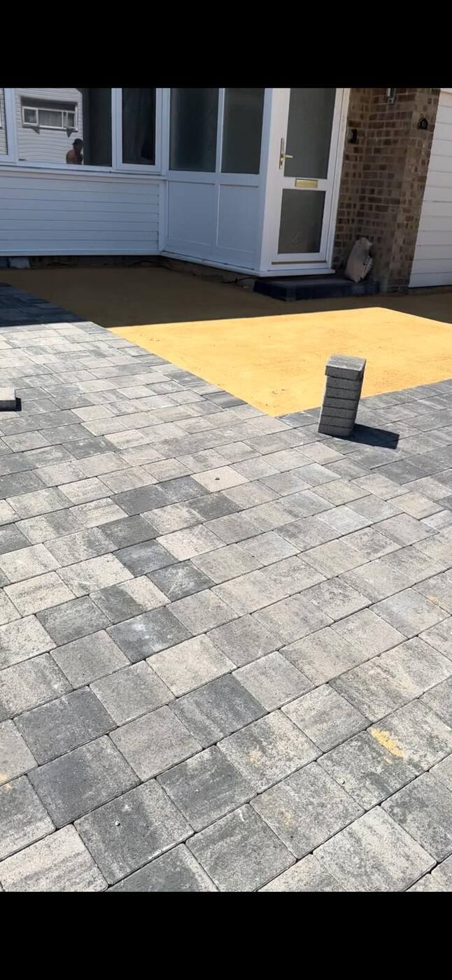 Block paving driveway mid-installation on sand bed